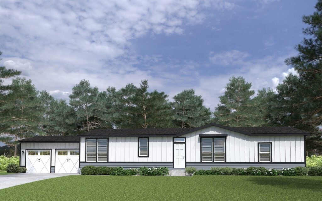 Modern manufactured home with white siding and black trim in a lush green setting.